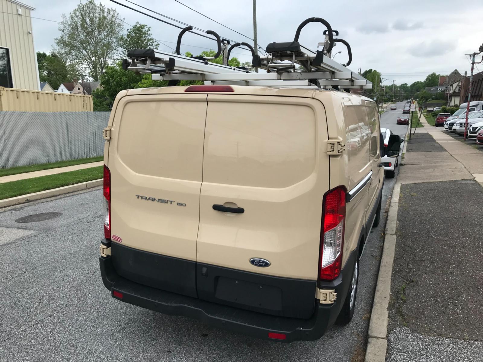 2017 Tan /Gray Ford Transit 150 (1FTYE1YM0HK) with an 3.7 V6 engine, Automatic transmission, located at 577 Chester Pike, Prospect Park, PA, 19076, (610) 237-1015, 39.886154, -75.302338 - 2017 Ford Transit 150: Ladder racks, multiple pieces of shelving, backup camera, partition, power locks and windows, FLEET MAINTAINED, runs LIKE NEW! This vehicle comes inspected and has been given a bumper to bumper safety check. It is very clean, reliable, and well maintained. We offer a unique - Photo #4
